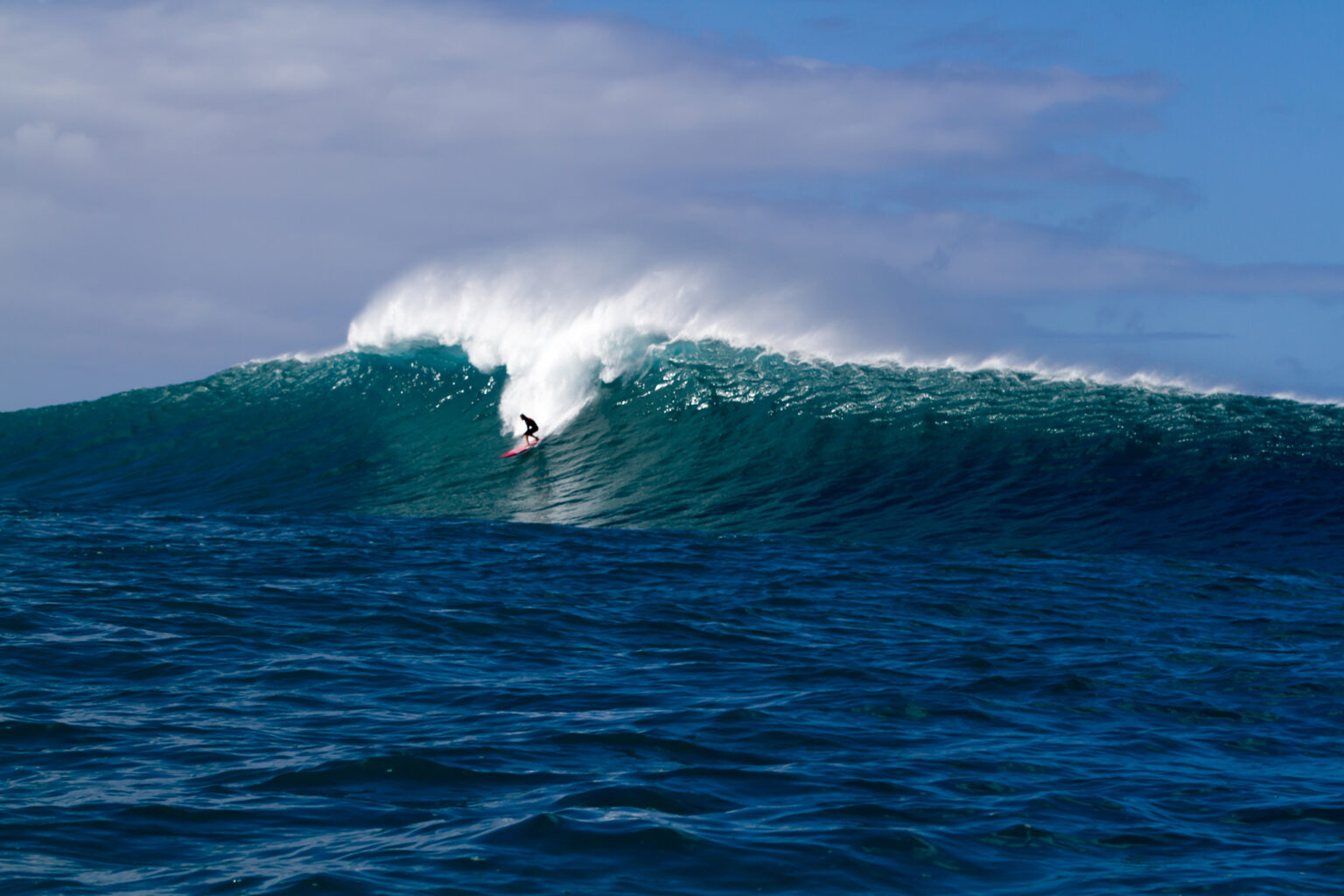 A Surfer on a big wave in Hawaii